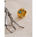 Gold Sculptural Ring with Turquoise Stone Center